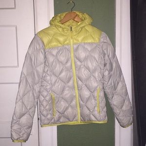White and yellow Women’s down jacket.
